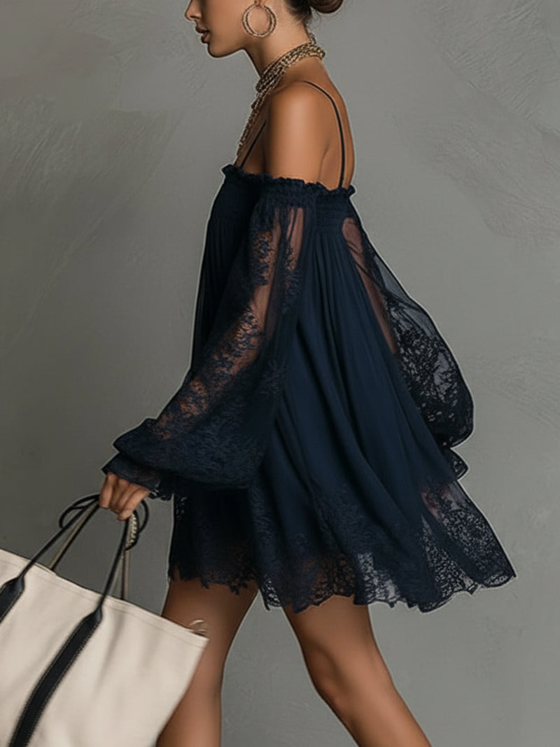 Detailansicht der feinen Spitzenapplikationen am eleganten Chiffonkleid