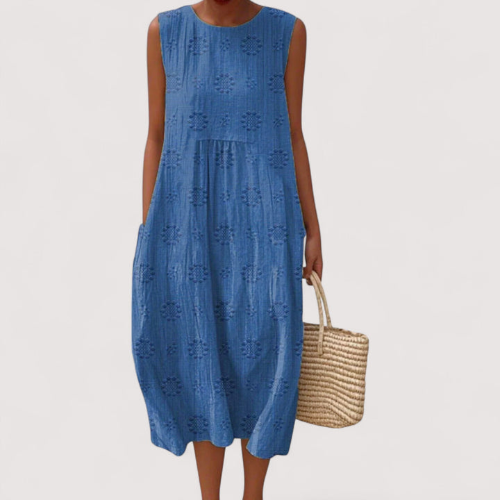 Luftiges Damen Blumenkleid, ärmellos, mit buntem Muster. Perfekt als leichtes Freizeit- oder Urlaubskleid.