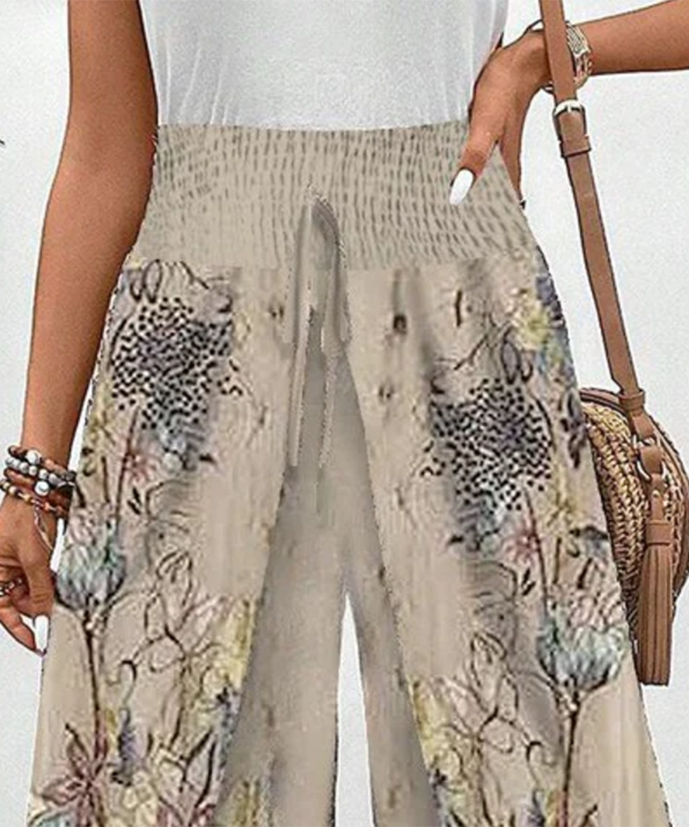 Stilvolle Damen Hose mit sommerlichem Blumenmuster und elastischem Bund. Ideal für Freizeit & Komfort.