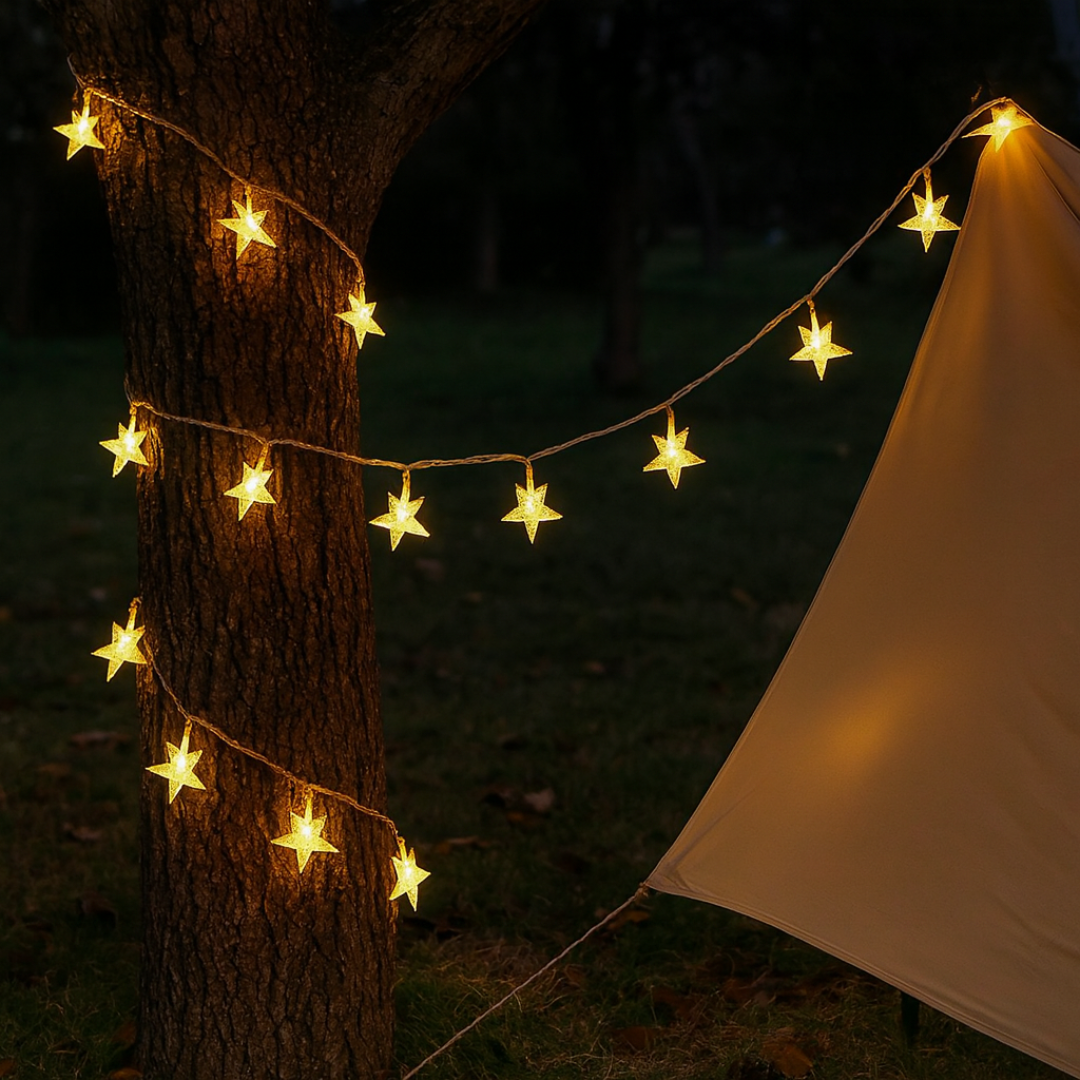 Sternen Lichterkette warmweiß draußen an einem Baum und Zelt montiert