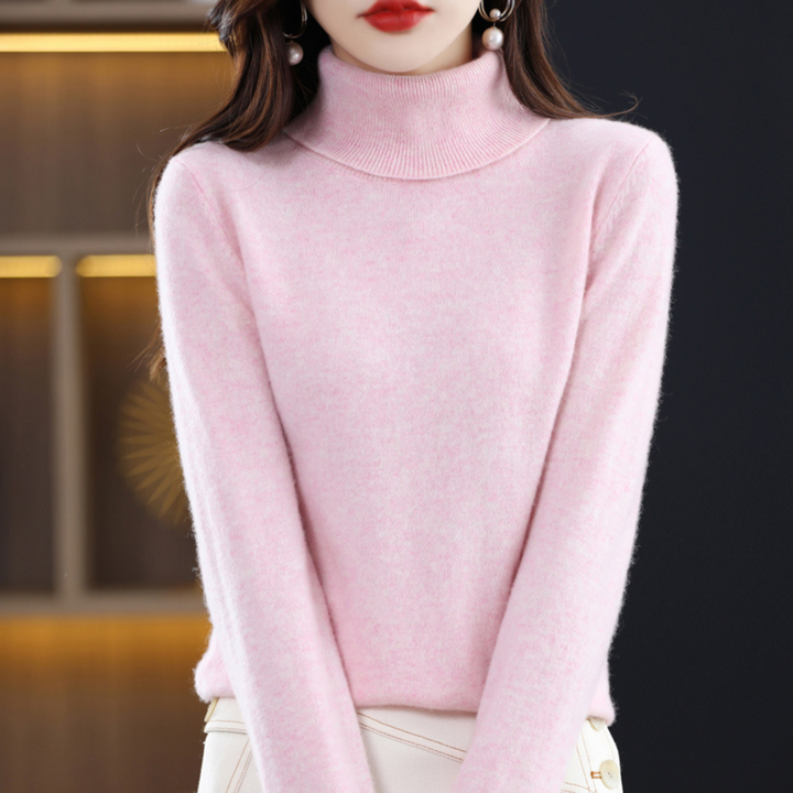 Frau in rosa Rollkragenpullover, weiches Material, modisch, elegant, Herbstmode.