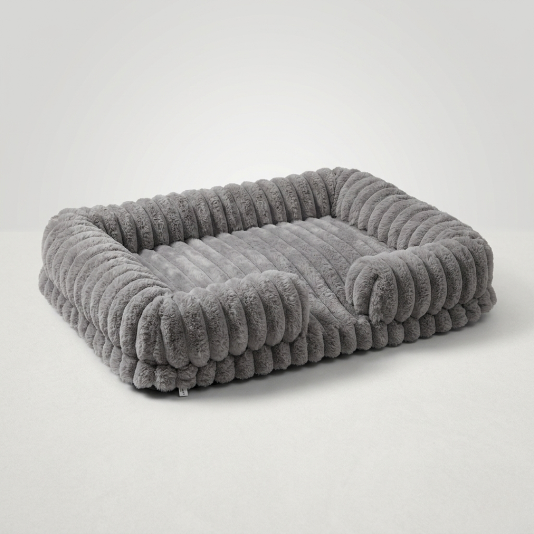 Bequemes orthopädisches Hundebett im Sofastil mit Memory-Schaum, ideal für gesunden Schlaf.