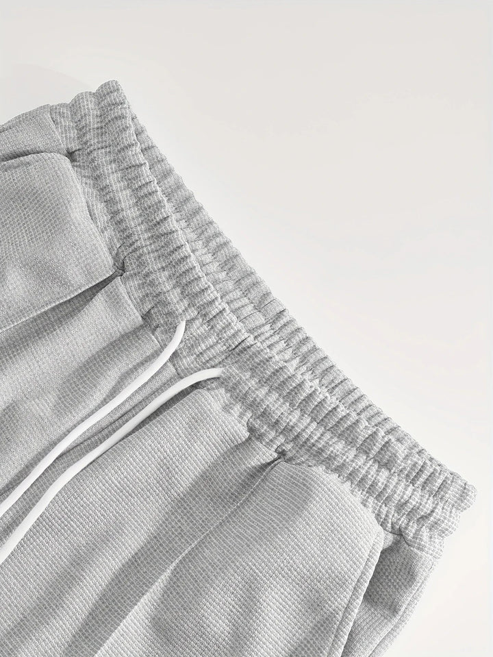 Elastischer Bund der Shorts im Herren Fitness Outfit, Nahaufnahme der Kordel