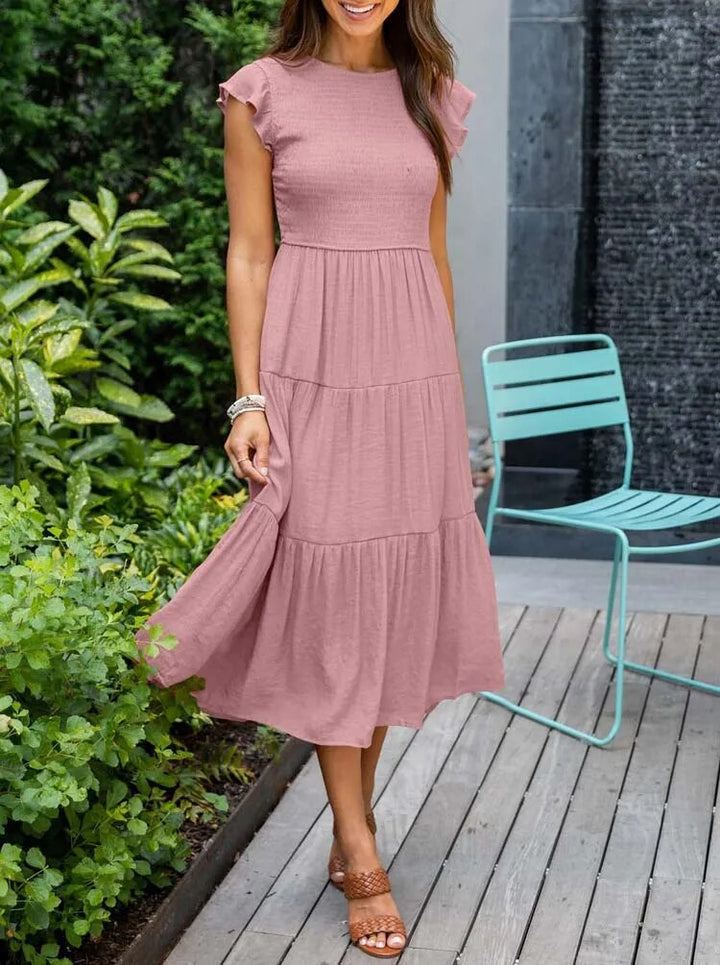 Vielseitiges Damenkleid in Rosa, perfekt für elegante Anlässe oder als bequemes Freizeitoutfit.