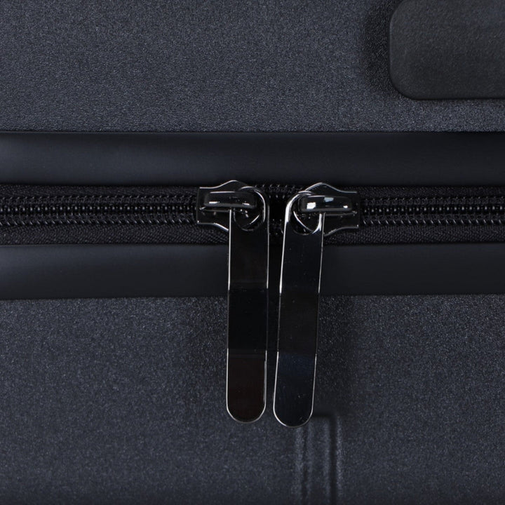 Gelber Hartschalen-Trolley, im Detail die vier leichtgängigen Doppelrollen.