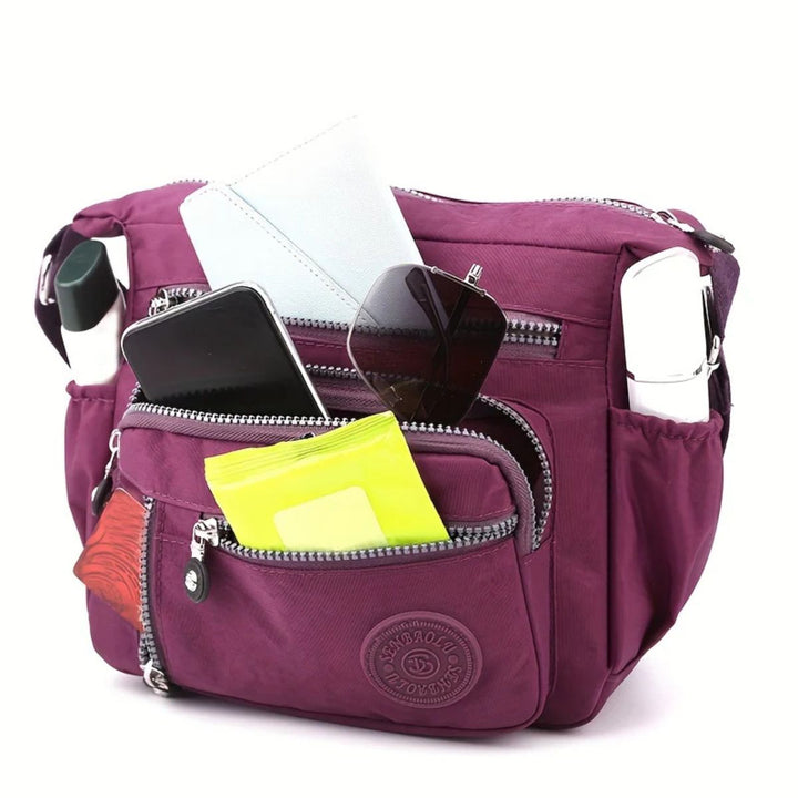 Vielseitige Damen Crossbody-Tasche mit Organizer-Funktion, elegant und praktisch für jede Gelegenheit.
