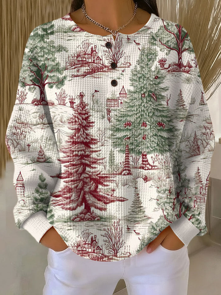 Nahaufnahme des gemusterten Damen Pullovers mit Waffelstrick und Knöpfen