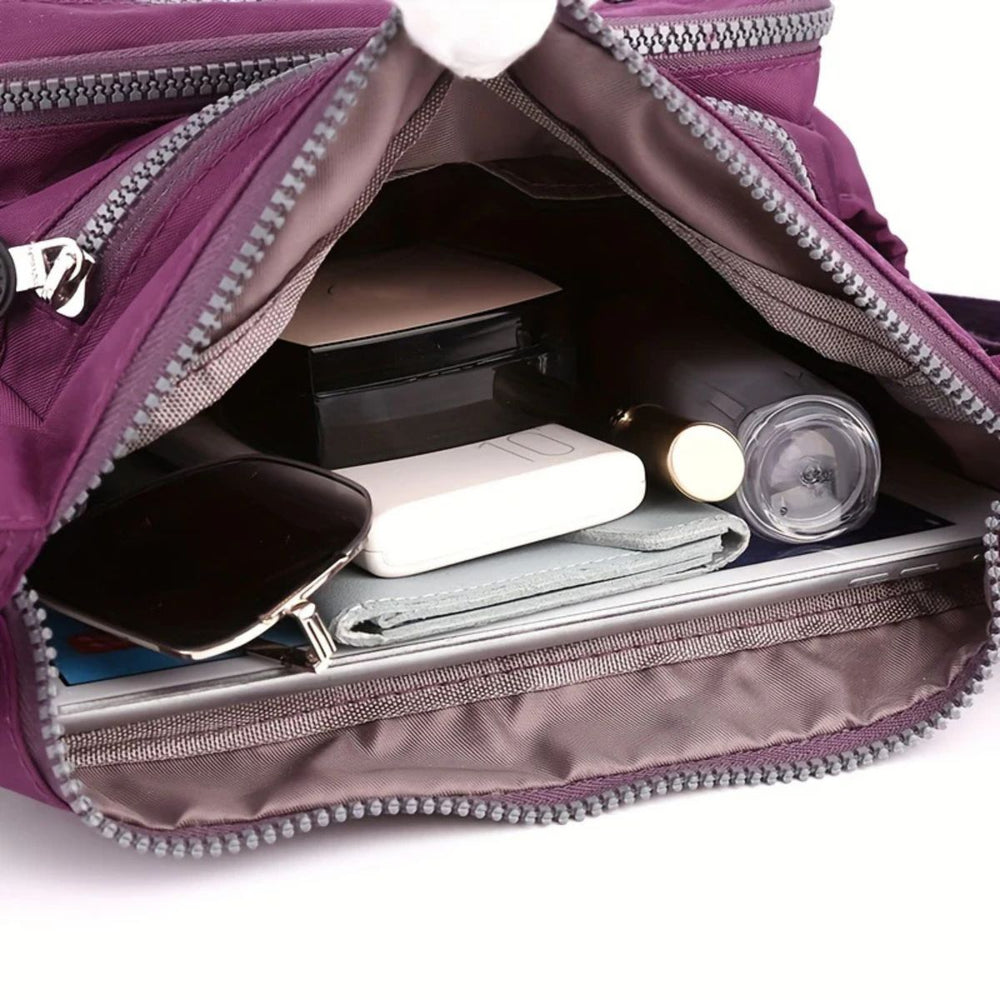Praktische Damen Umhängetasche mit vielen Fächern & Organizer-Funktion für Handy, Geldbörse & Schlüssel.