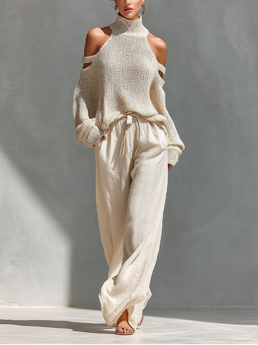 Damen Strick-Off-Shoulder-Top und weite Hosen in Beige vor grauem Hintergrund