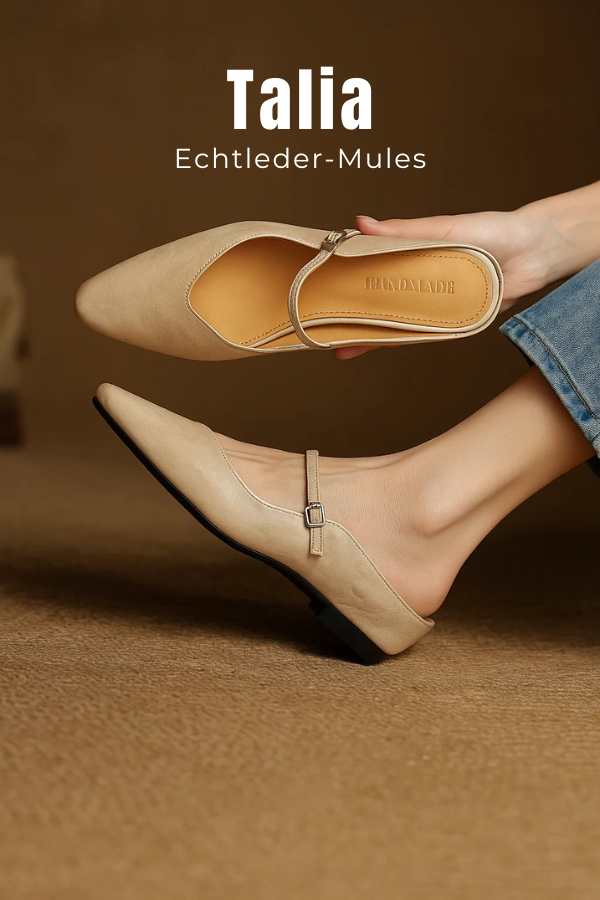 Frau trägt elegante, spitze Mary Jane Pantoletten mit Riemen. Bequeme Damenschuhe für Büro & Alltag.