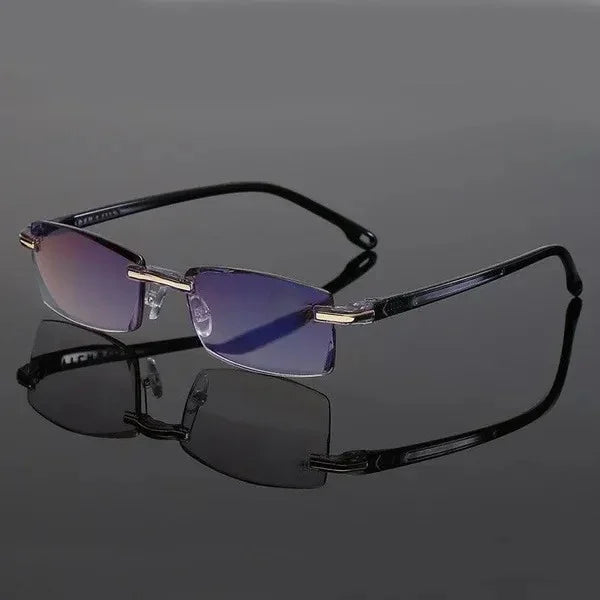 Schwarz randlose Brille mit blauen Gläsern auf grauem Hintergrund.