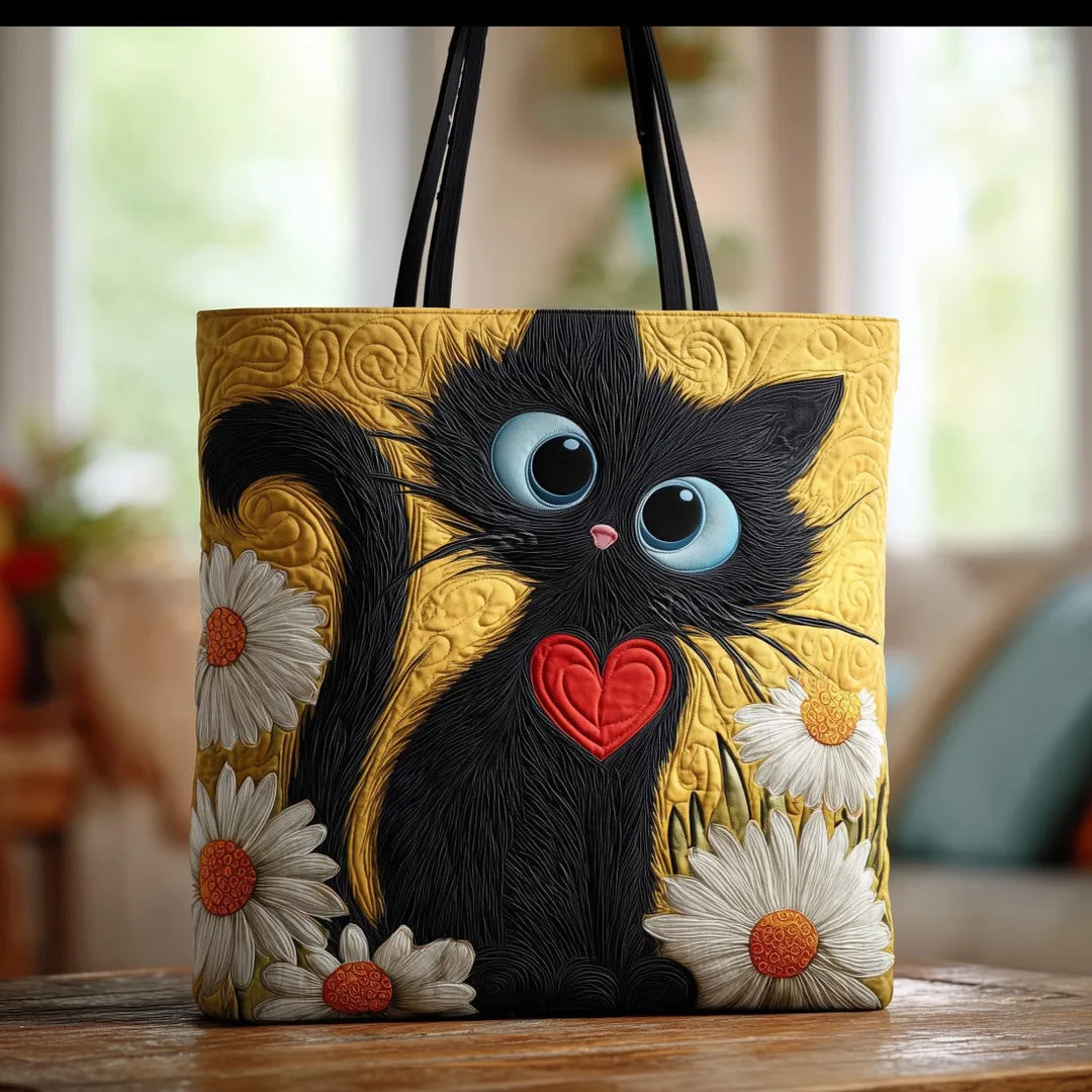 Handgefertigte schwarze Katzenhandtasche mit Herz und Margeriten Motiv auf Holztisch