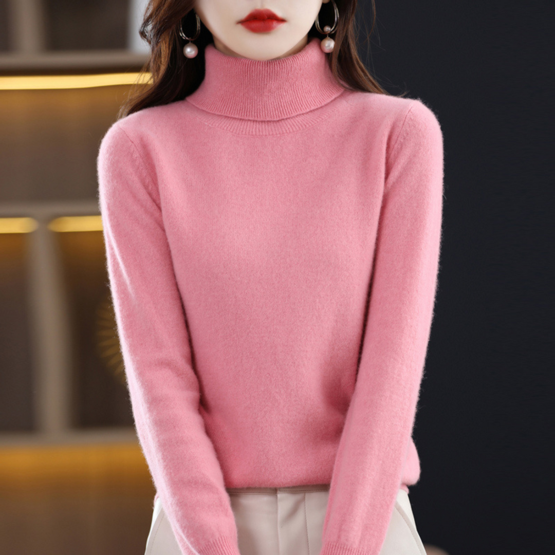Frau in rosa Rollkragenpullover aus Kaschmir, elegant, modisch, Wintermode, Damenbekleidung.