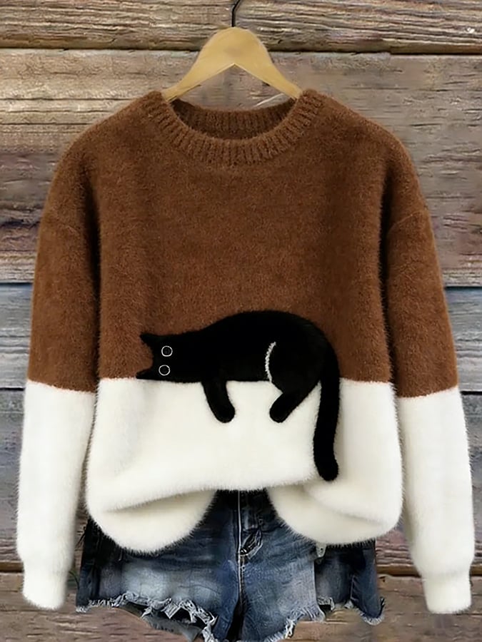 Damenpullover oversized mit Katzenmotiv, Saum und Strickstruktur im Detail