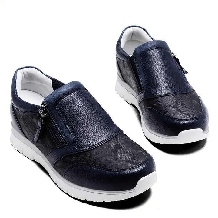 Elegante blaue Damen Sportschuhe mit rutschfester Sohle und seitlichem Reißverschluss.