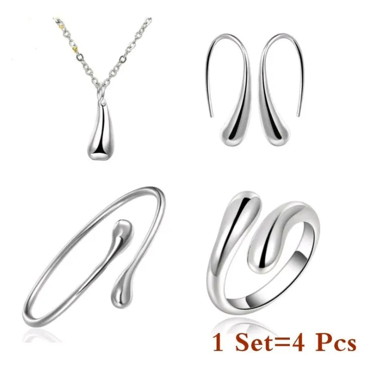 Silberner Schmuckset: Halskette, Ohrringe, Armband, Ring, modern, minimalistisch, 4-teilig.