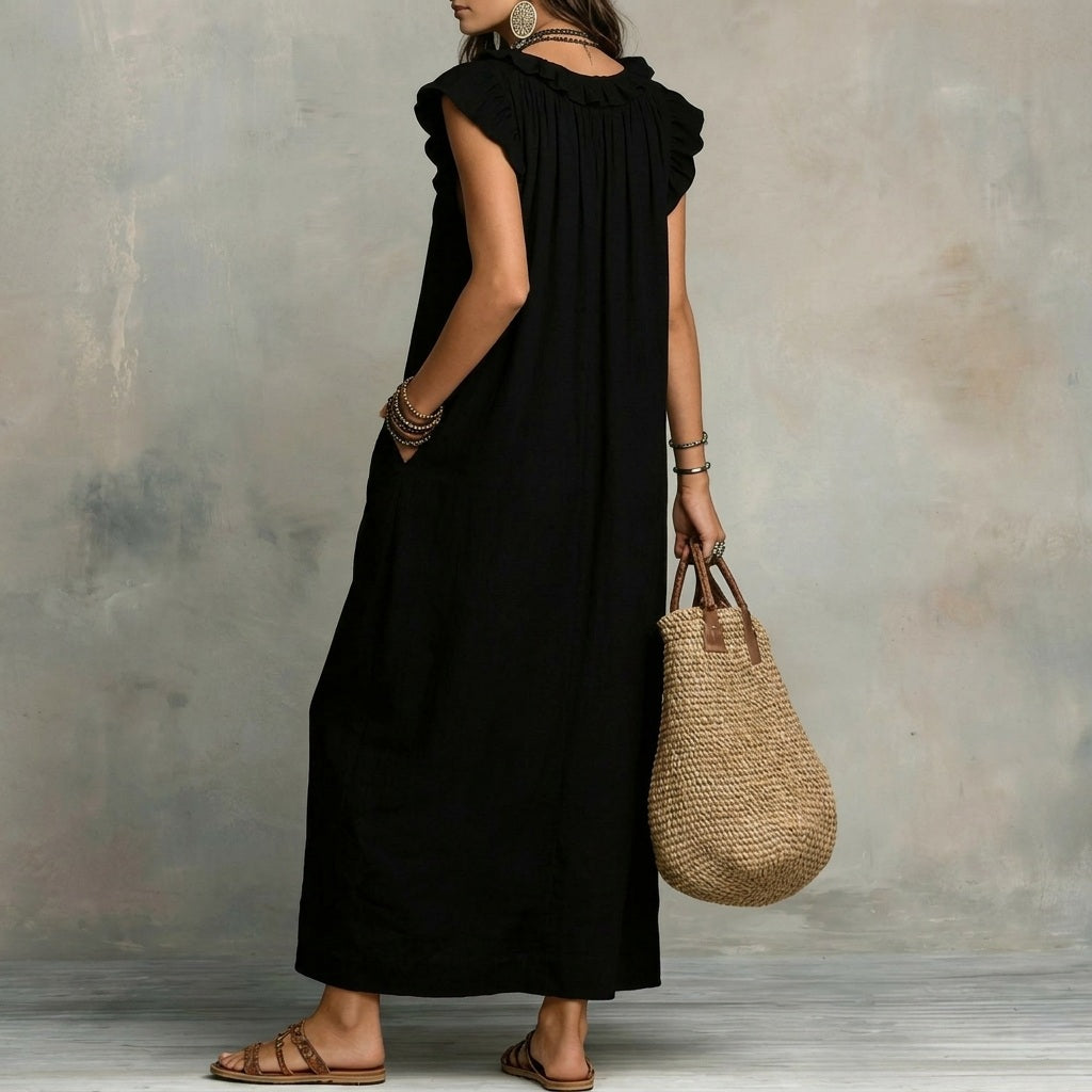 Damen Maxikleid in Schwarz mit Rüschen von hinten präsentiert