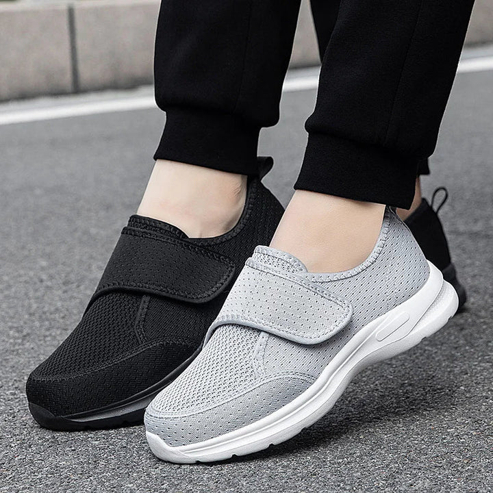 Medizinischer Gehschuh in Grau und Schwarz von der Seite