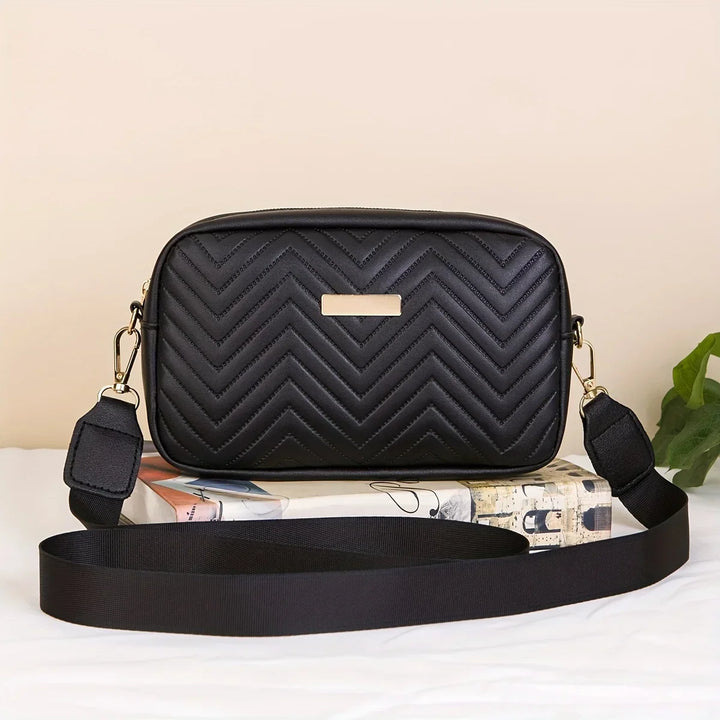 Elegante schwarze Damen Umhängetasche mit gestepptem Zickzack-Muster und goldenem Detail