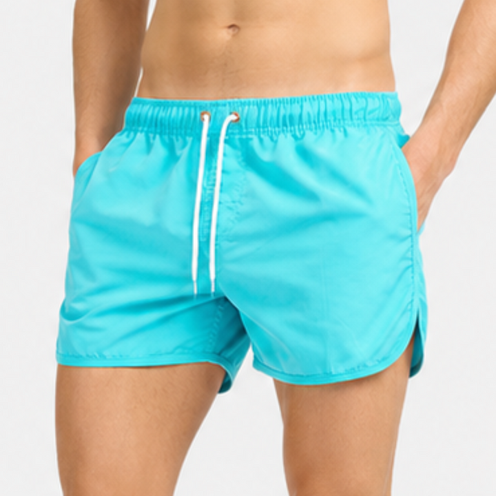 Sommerliche Tiefbund-Schwimmshorts Tidewell für Herren, kurze Länge, perfekte Strandmode für aktive Männer.