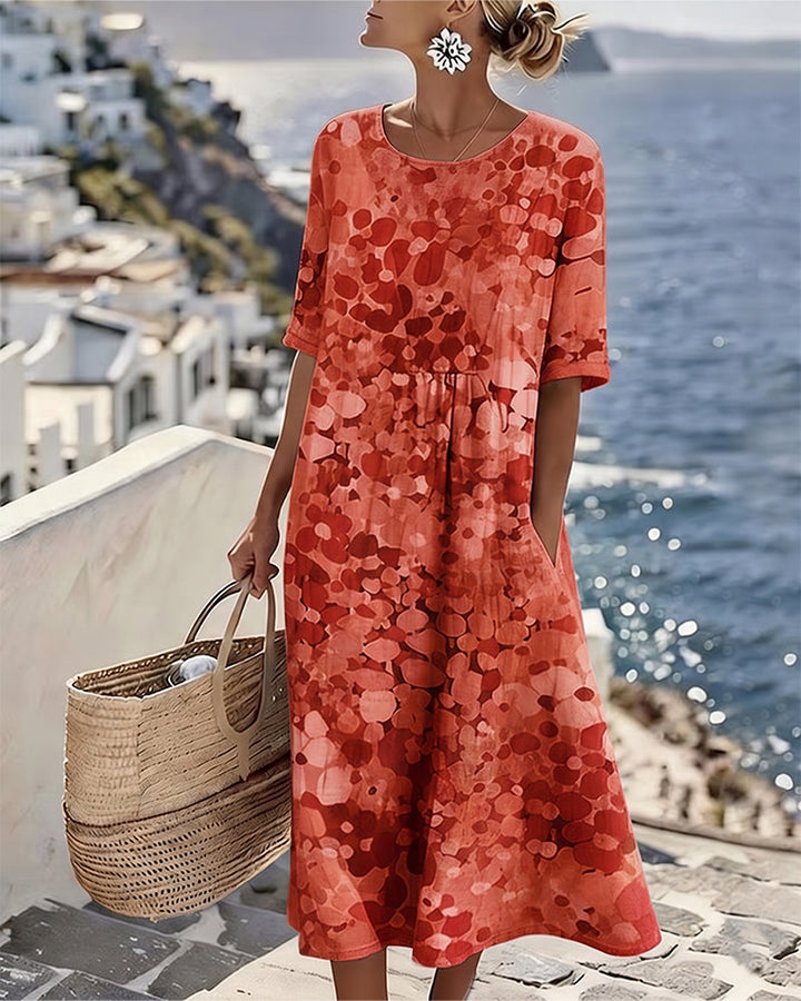 Sommermode für Damen: Luftiges Blumenkleid in angesagter Midi-Länge