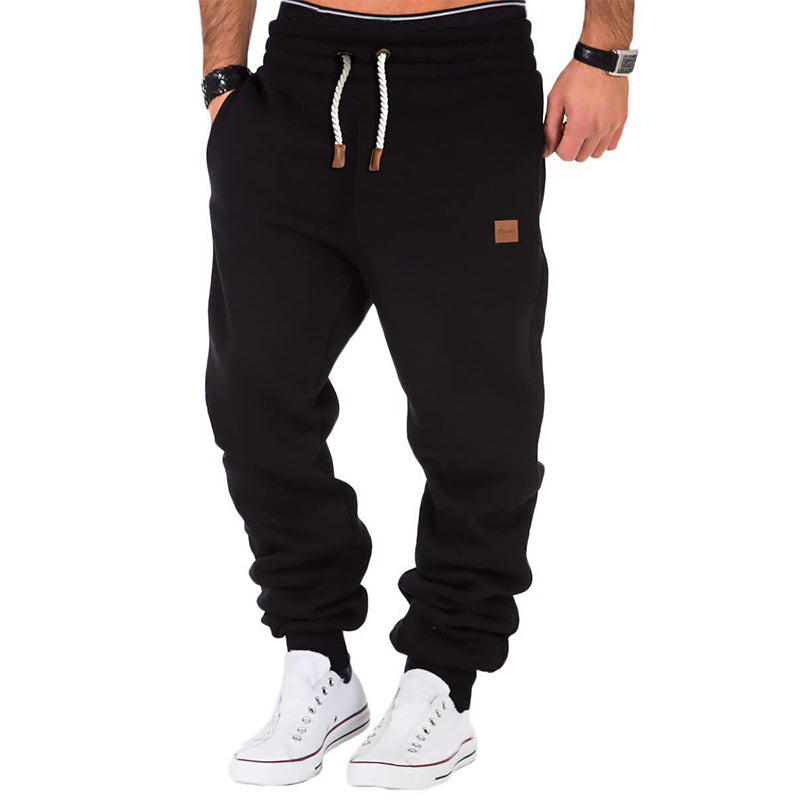Stilvolle Herren Sporthose in Grau mit Kordelzug, perfekt für Training, Jogging oder entspannte Workouts.