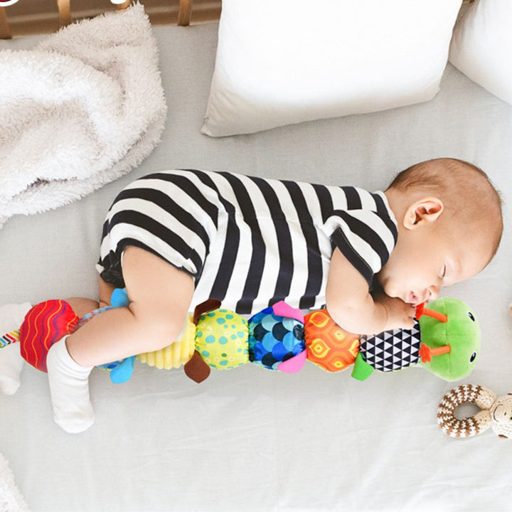 "Bunte Plüsch-Musikraupe für Babys, leuchtende Farben, weiche Texturen, Musikfunktion, fördert sensorische Entwicklung"