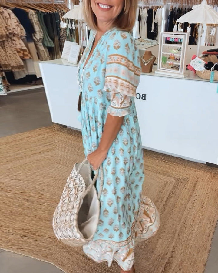 Modisches Damen Sommerkleid, bedrucktes Midikleid mit tiefem V-Ausschnitt. Perfekt für warme Tage.