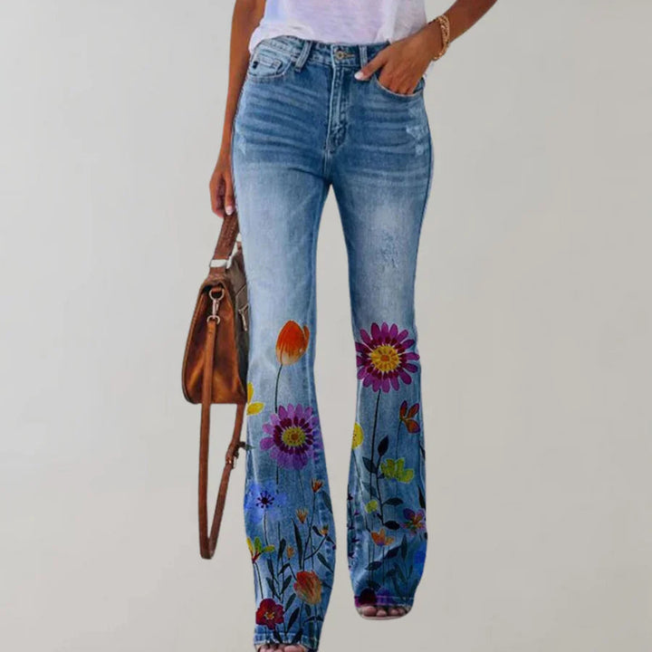 Damen Flare Jeans mit lebhaftem Blumenmuster, hoher Bund, für stilvollen Retro Look.