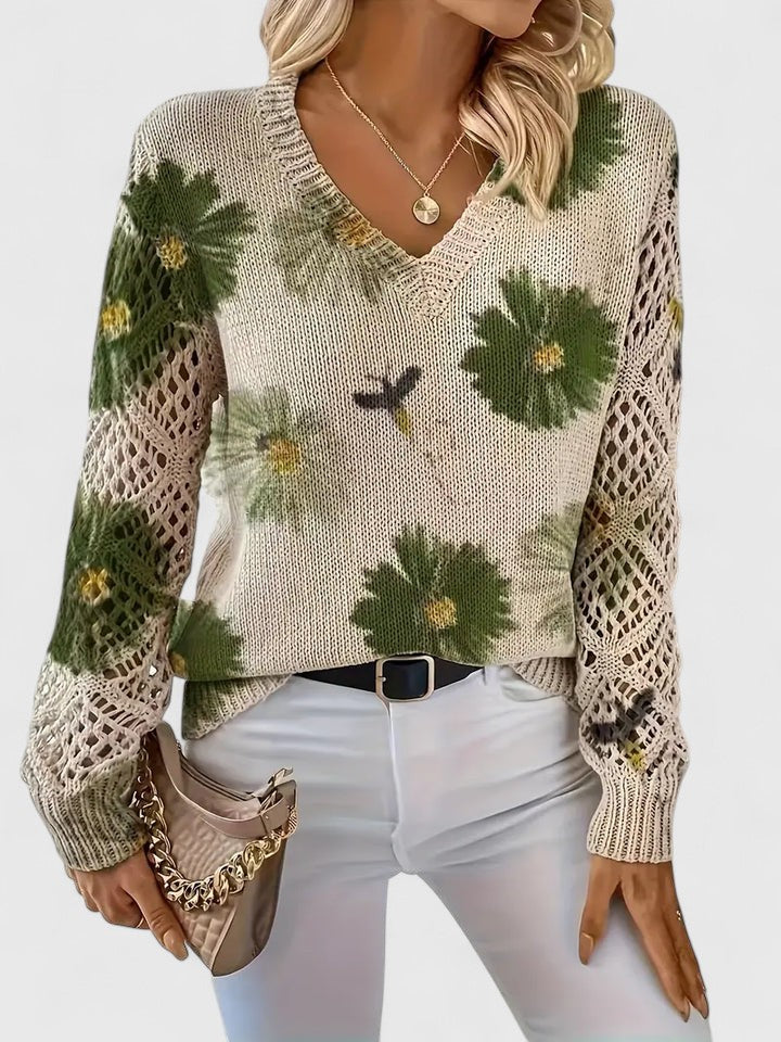 Moderne Herbstbluse für Frauen mit lebhaftem Blumenmuster und Langarmdesign.