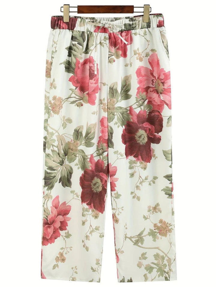 Modische Damenhose mit Blumenmuster, weitem Bein und bequemem Elastikbund. Perfekte Freizeithose für Frühling/Herbst.