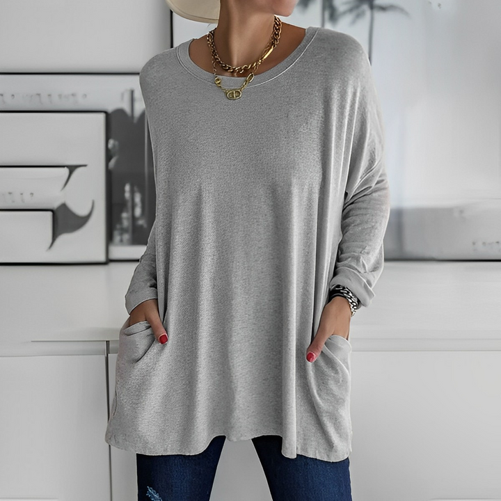 Damen Longpullover mit praktischen Taschen für stylischen Komfort im Alltag.