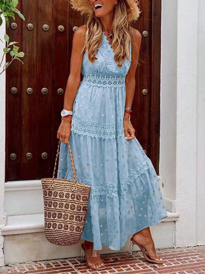 Langes, luftiges Damenkleid für den Sommer mit Blumenmuster und bequemem Kordelzug.
