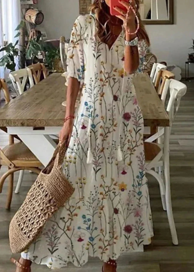 Grünes Damen Maxikleid, elegant mit floralem Muster und verstellbarem Kordelzug, sommerlich und chic.