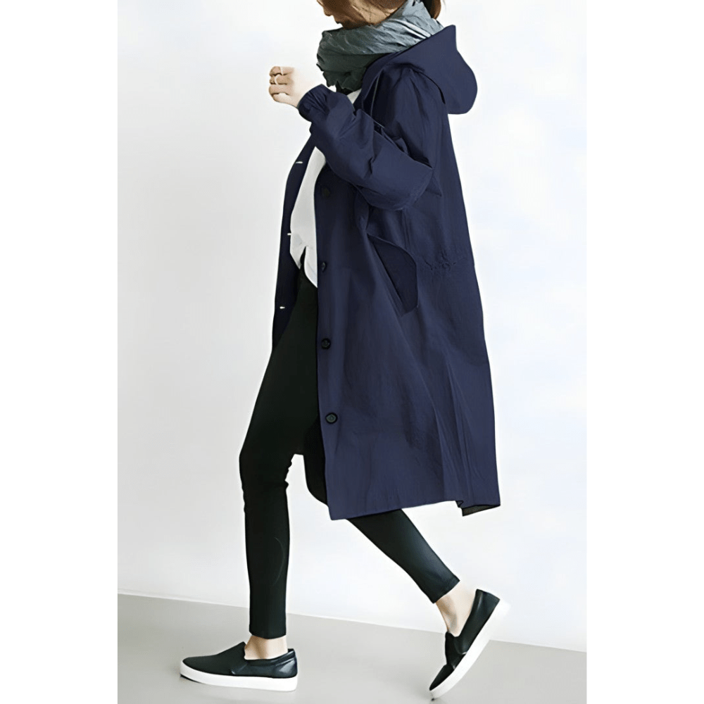 Moderner Damen Trenchcoat in Midilänge, figurumspielend. Zeitloser Klassiker für Eleganz an kühlen Tagen.