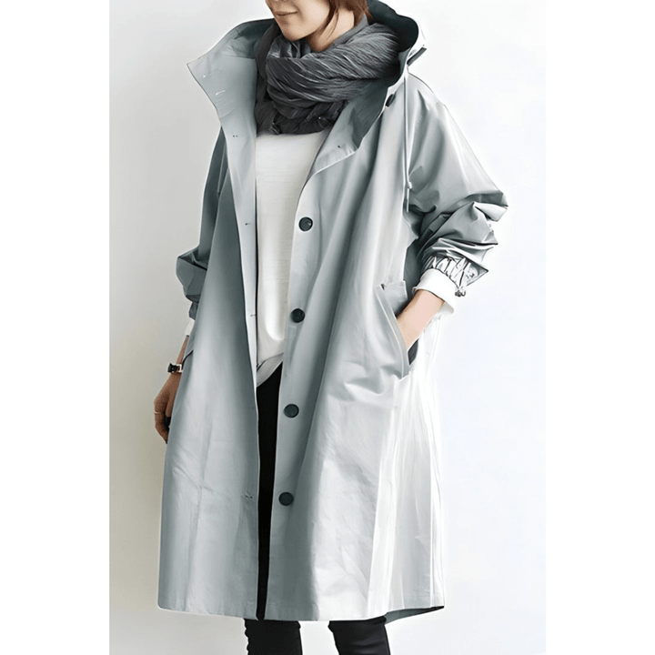 Eleganter Damen Trenchcoat Midilänge mit Reverskragen. Ideale Übergangsjacke für stilvolle Herbstoutfits.