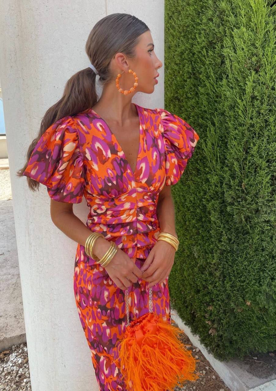 Damen Sommer Midi-Kleid mit bedruckten Puffärmeln in leuchtenden Farben, ideal für Freizeit & Urlaub. Elegant & leicht.