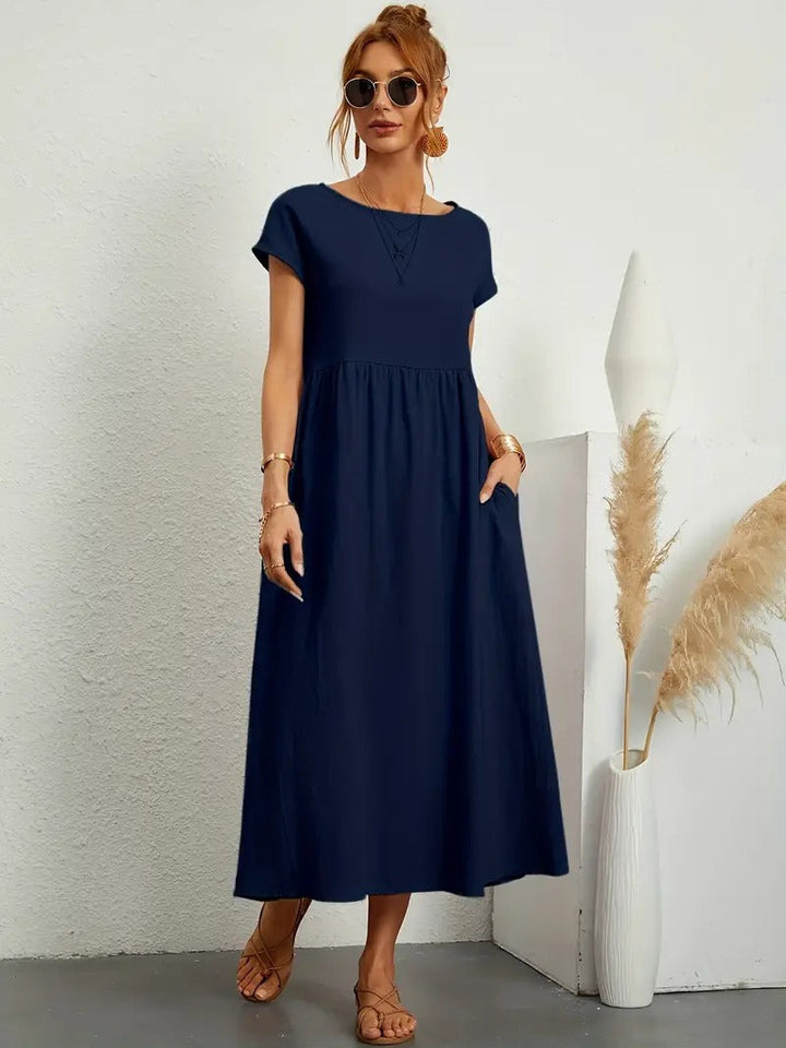 Stilvolles Sommer Midikleid für Damen mit Kurzarm und praktischen Eingrifftaschen.