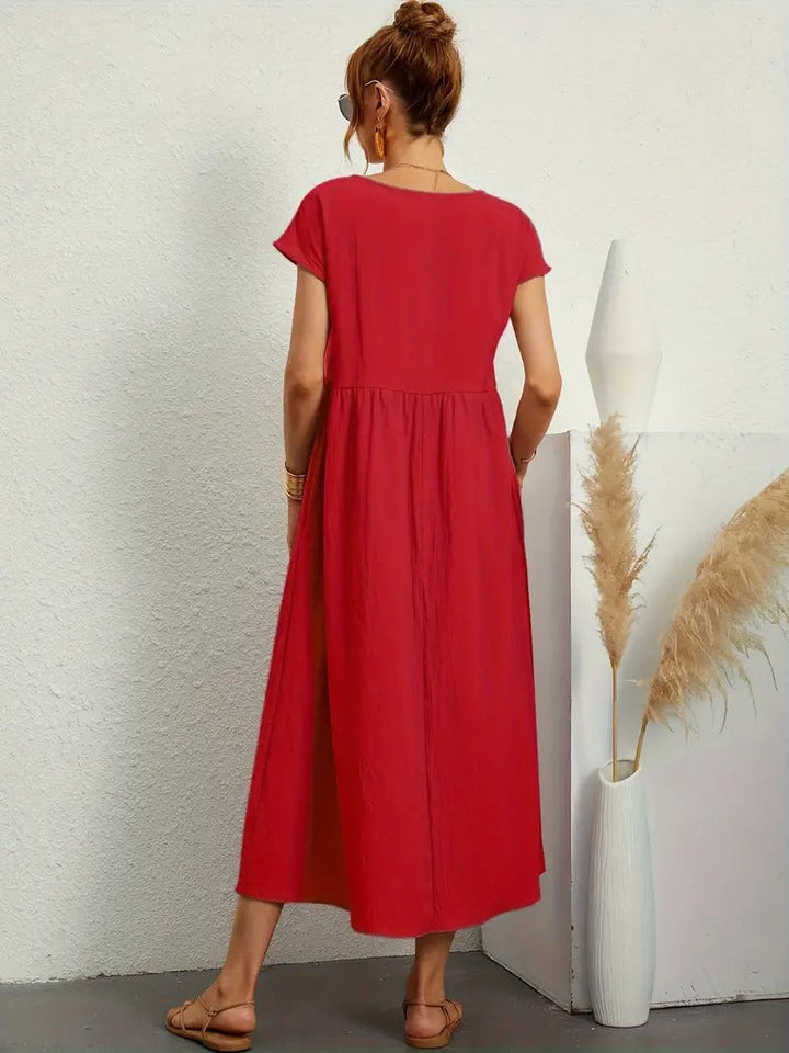 Elegantes Kurzarm Midikleid für Damen mit Seitentaschen, vielseitig für jeden Tag.