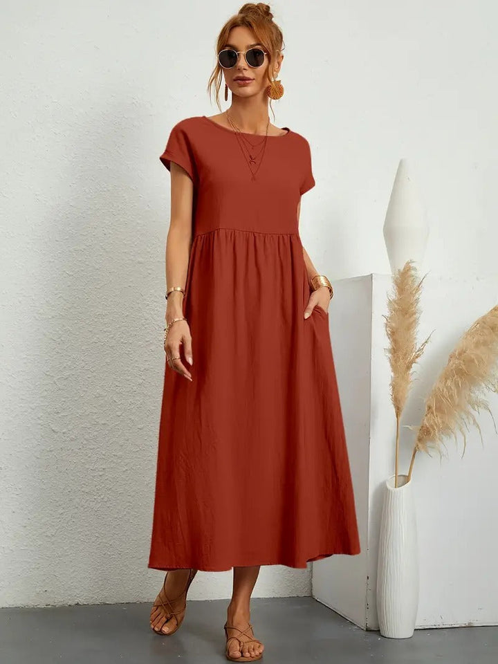Modisches Damen Sommer Midikleid mit praktischen Taschen, elegant & entspannt geschnitten.