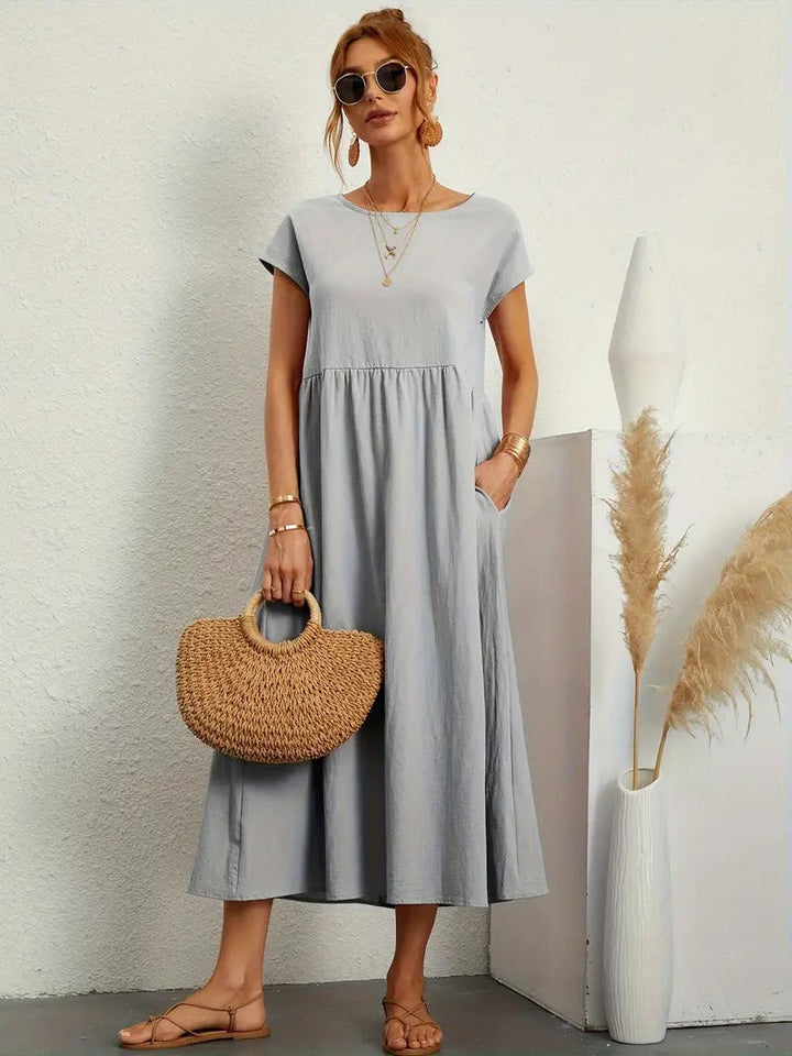 Damen Midikleid mit eleganten Eingrifftaschen, vielseitig kombinierbar für Frühjahr/Sommer.