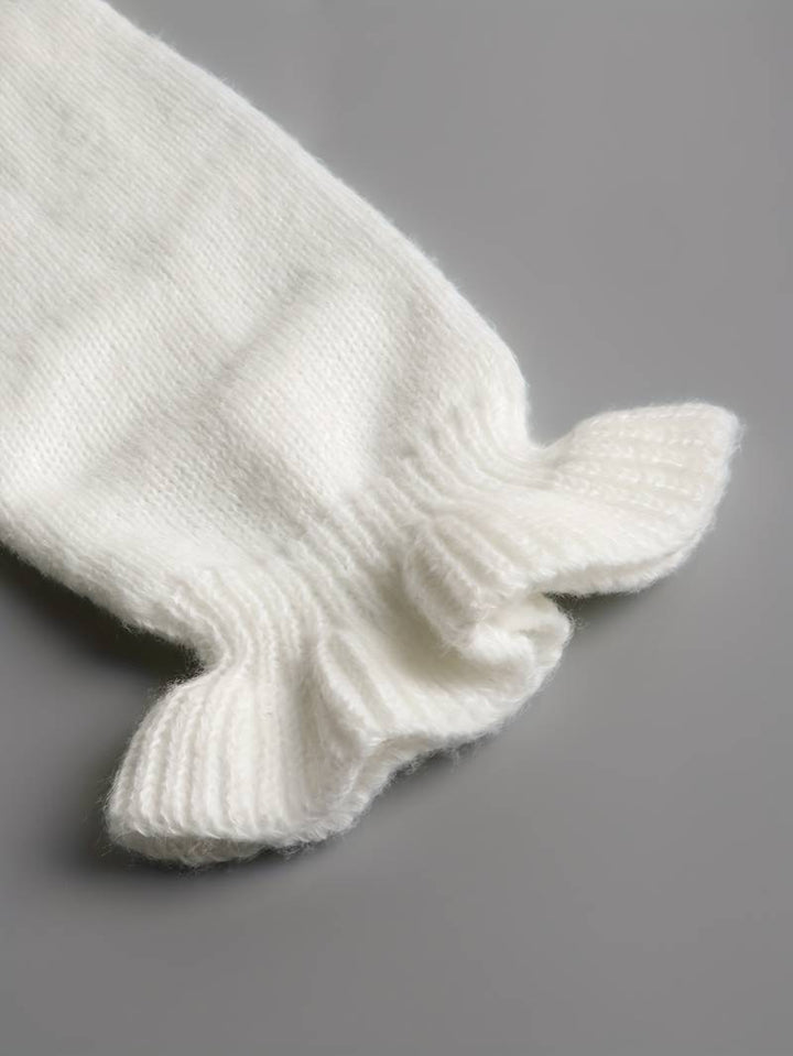 Hochwertiger Damenpullover mit V-Ausschnitt und dekorativem Knotendetail, ein Must-have für die Herbstmode.