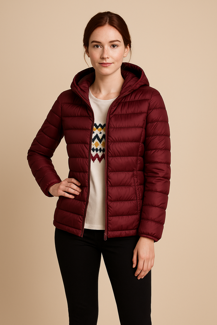 Damen Steppjacke mit Kapuze und figurbetonter Taille, warm und modisch, die perfekte Oberbekleidung für kühle Tage.