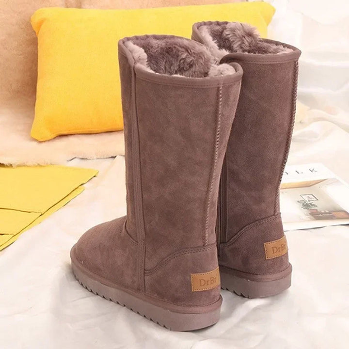Warme Damen-Schneestiefel, kniehoch & wasserdicht. Bieten Komfort und Rutschfestigkeit auf Eis und Schnee.