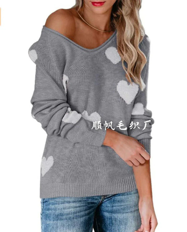 Festlicher Damen Strickpullover mit Herzmotiv, ideal für Weihnachten. Warmer Langarmpullover für Wintermode.