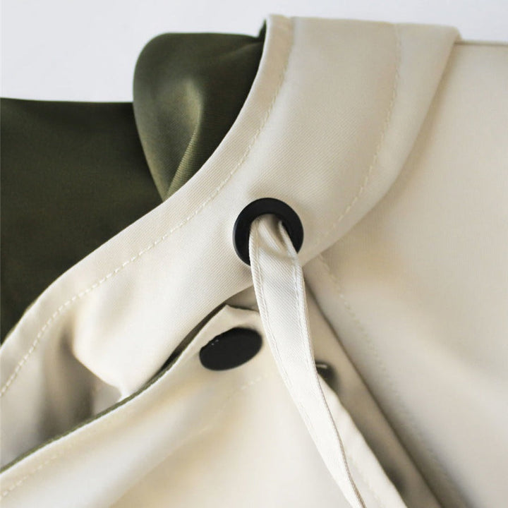 Stilvolle, winddichte Damen Outdoor-Jacke, wasserdicht, mit Kapuze & Taillenzug, für herbstliche Tage.