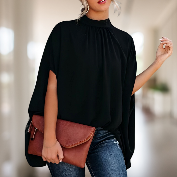 Elegante Damenbluse mit lässigem Schnitt und luftigem Design, vielseitig kombinierbar, ideal für Alltag und besondere Anlässe.