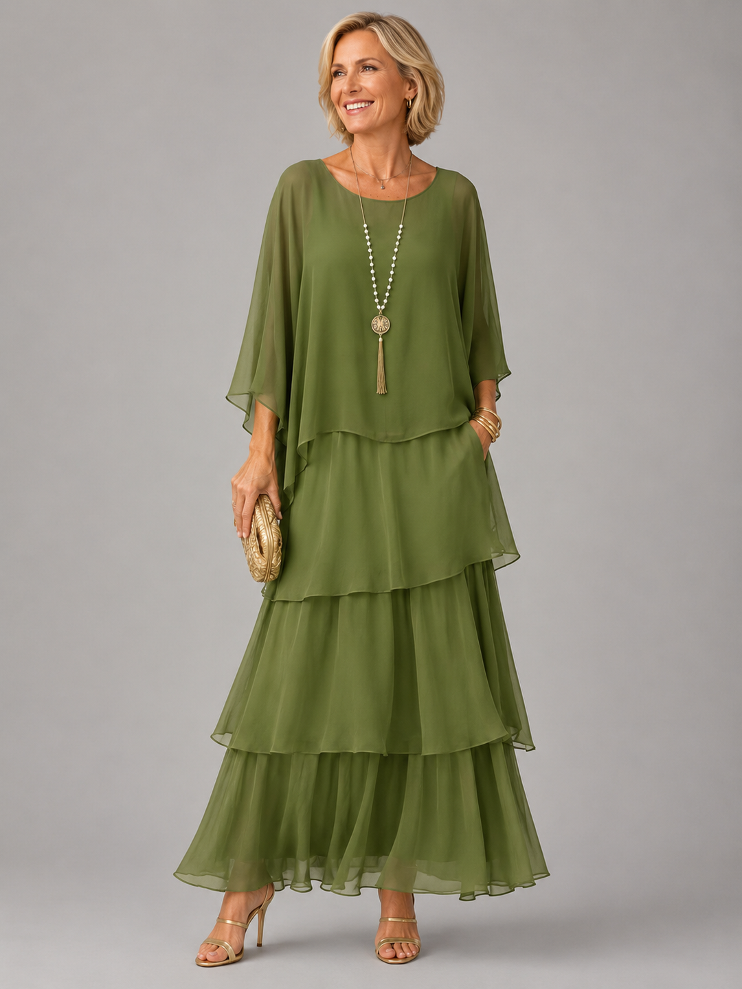Model in an olive green long maxi dress with tiered layers