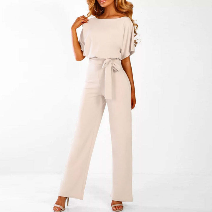 "Dunkelblauer Damen-Jumpsuit mit weiter Silhouette, gebundener Taille und eleganter Optik, passend für Events"