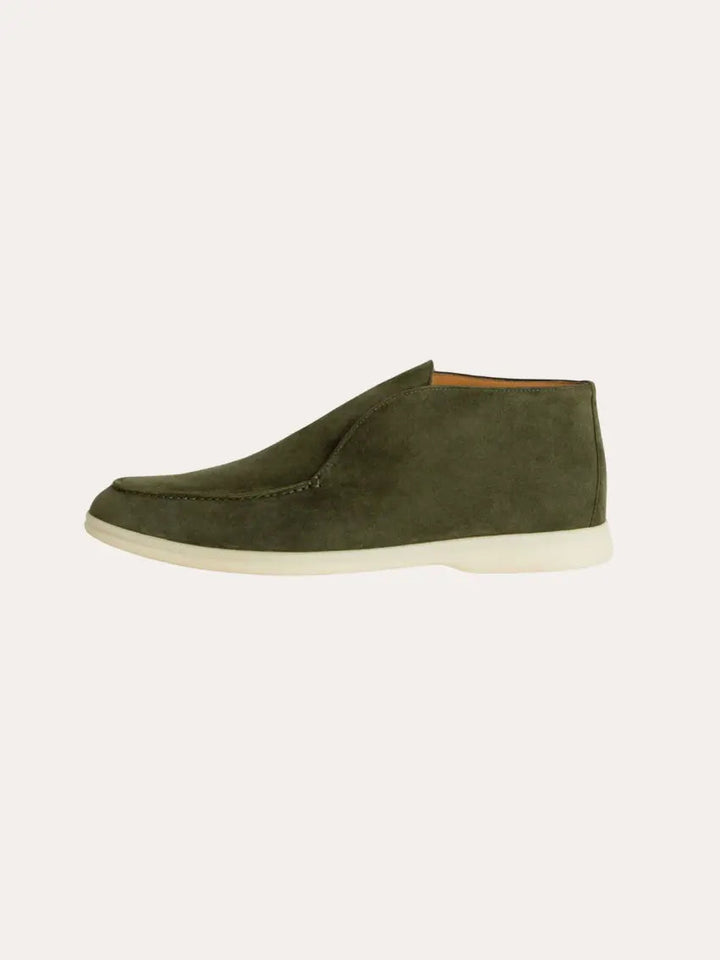 Bequeme tiefgrüne Herren-Schlupfschuhe, die Eleganz und Komfort vereinen. Ideal für den modernen Mann.